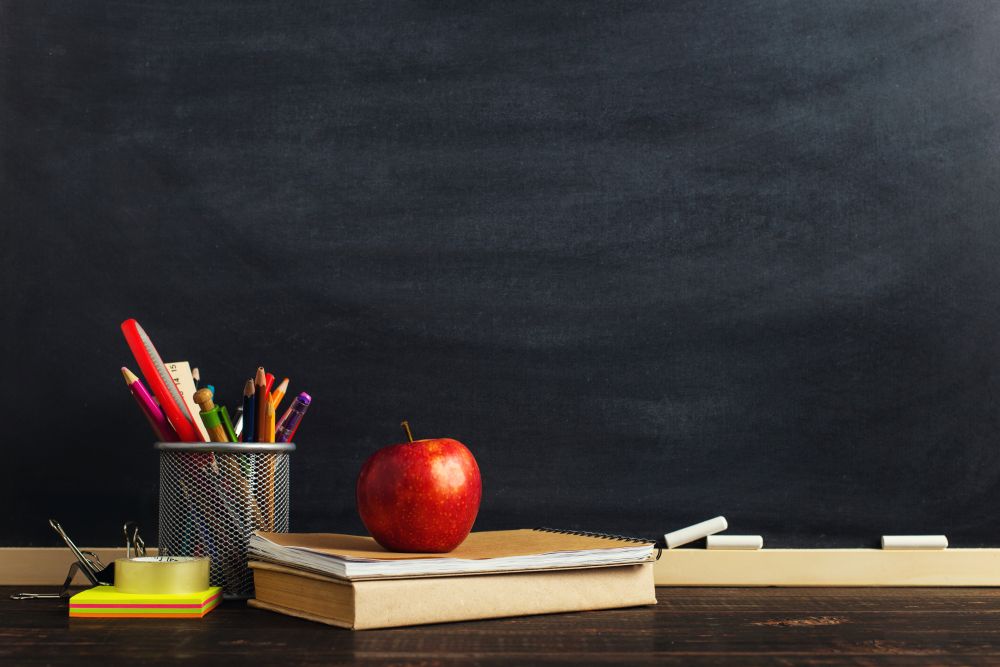 teachers desk and chalkboard